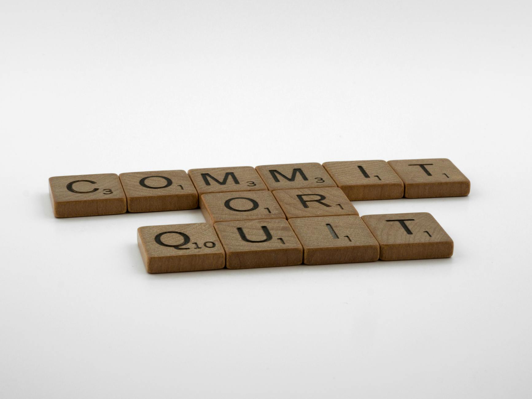 brown wooden scrabble tiles on white surface